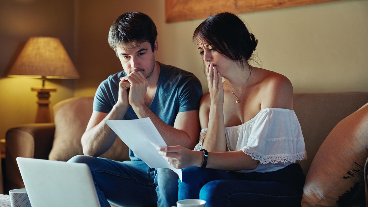 Couple worried looking at document
