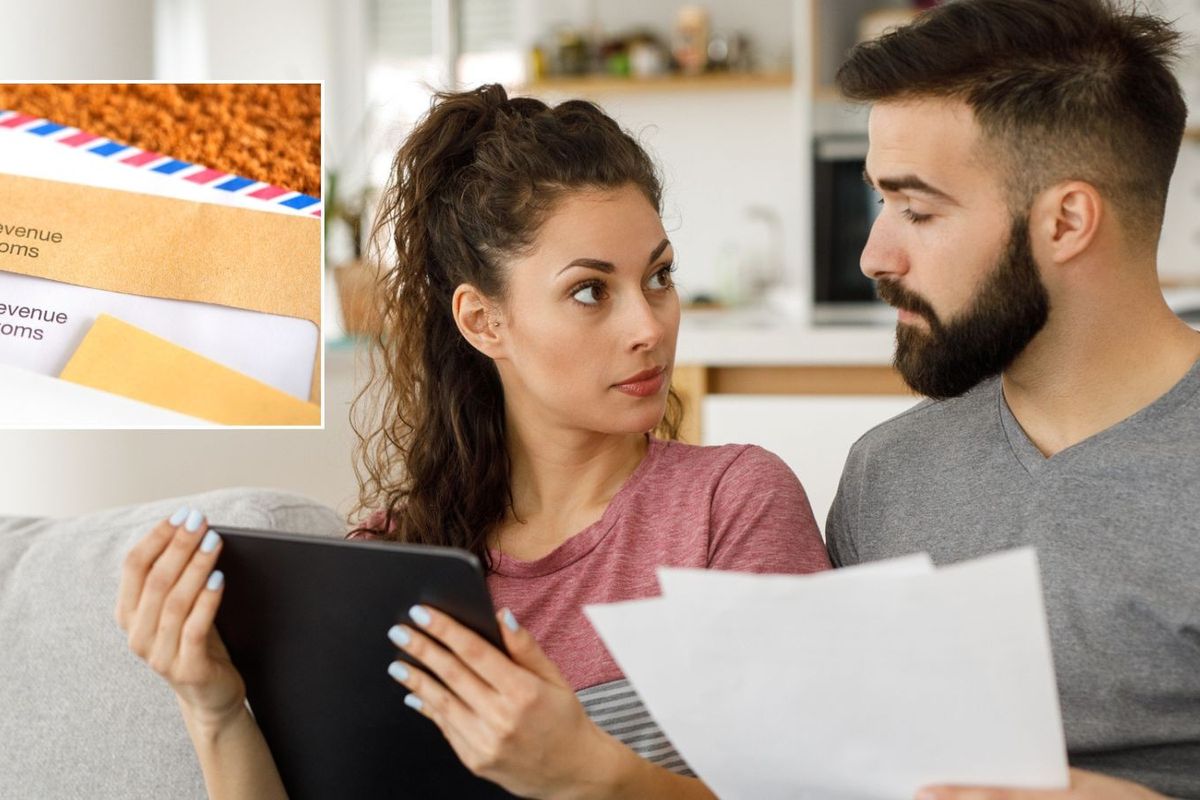 Couple worried looking at HMRC letter