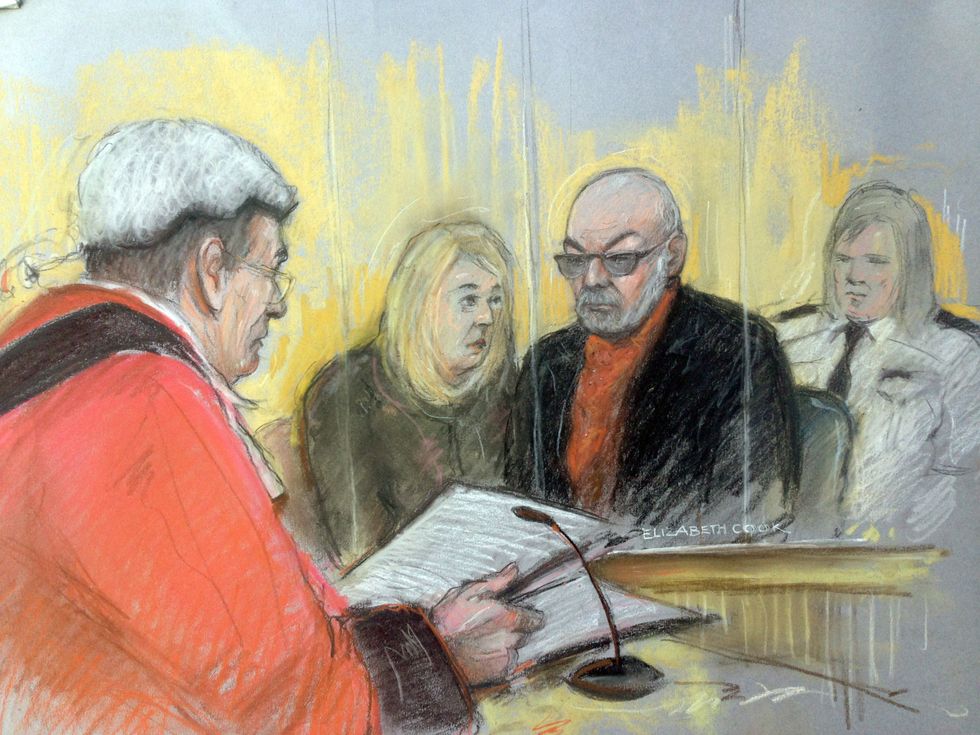 Court artist sketch by Elizabeth Cook of former glam rock singer Gary Glitter who was jailed for16 years for sexually abusing three schoolgirls. Glitter relied upon an interpreter (pictured) in the dock to inform him of the sentence passed as he was unable to hear the judge.
