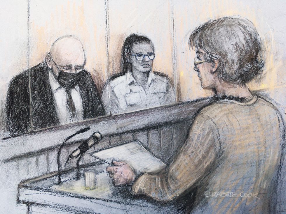 Court artist sketch by Elizabeth Cook of Susan Everard (right), the mother of Sarah Everard, reading a victim impact statement as former Metropolitan Police officer Wayne Couzens (left), 48, sits in the dock at the Old Bailey.