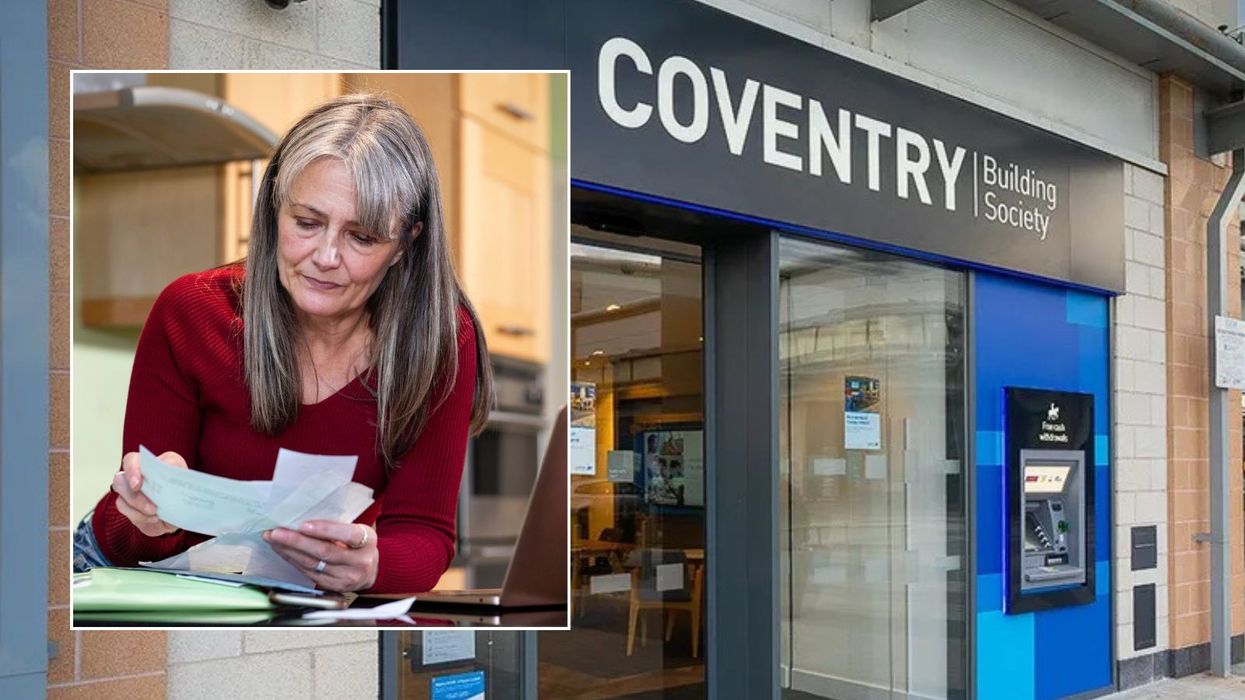 Coventry Building Society and woman looking at bills