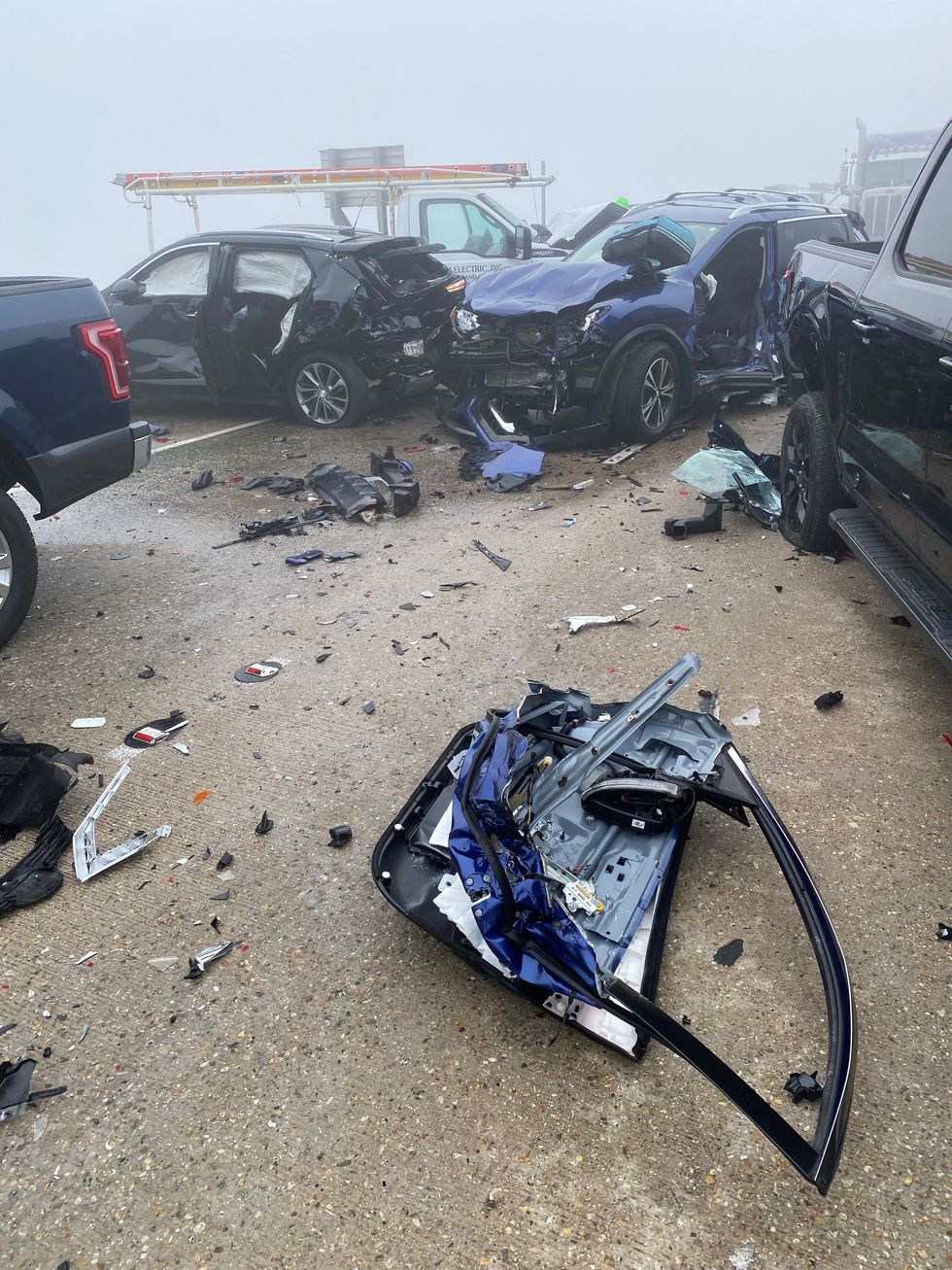 Crashed cars and debris are seen along street in Louisiana
