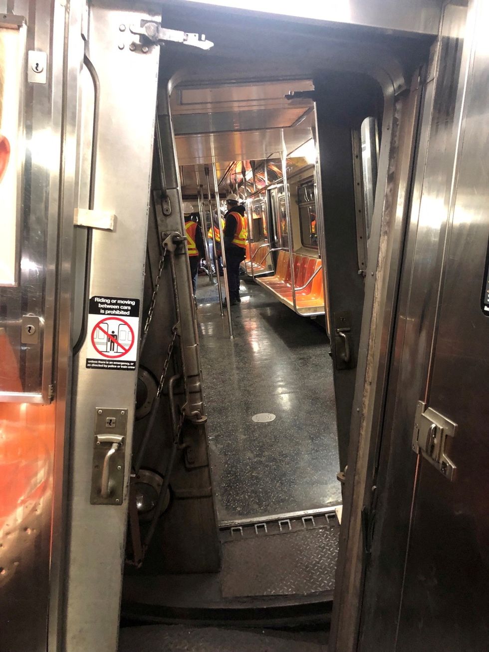Crew members assess derailed train in New York