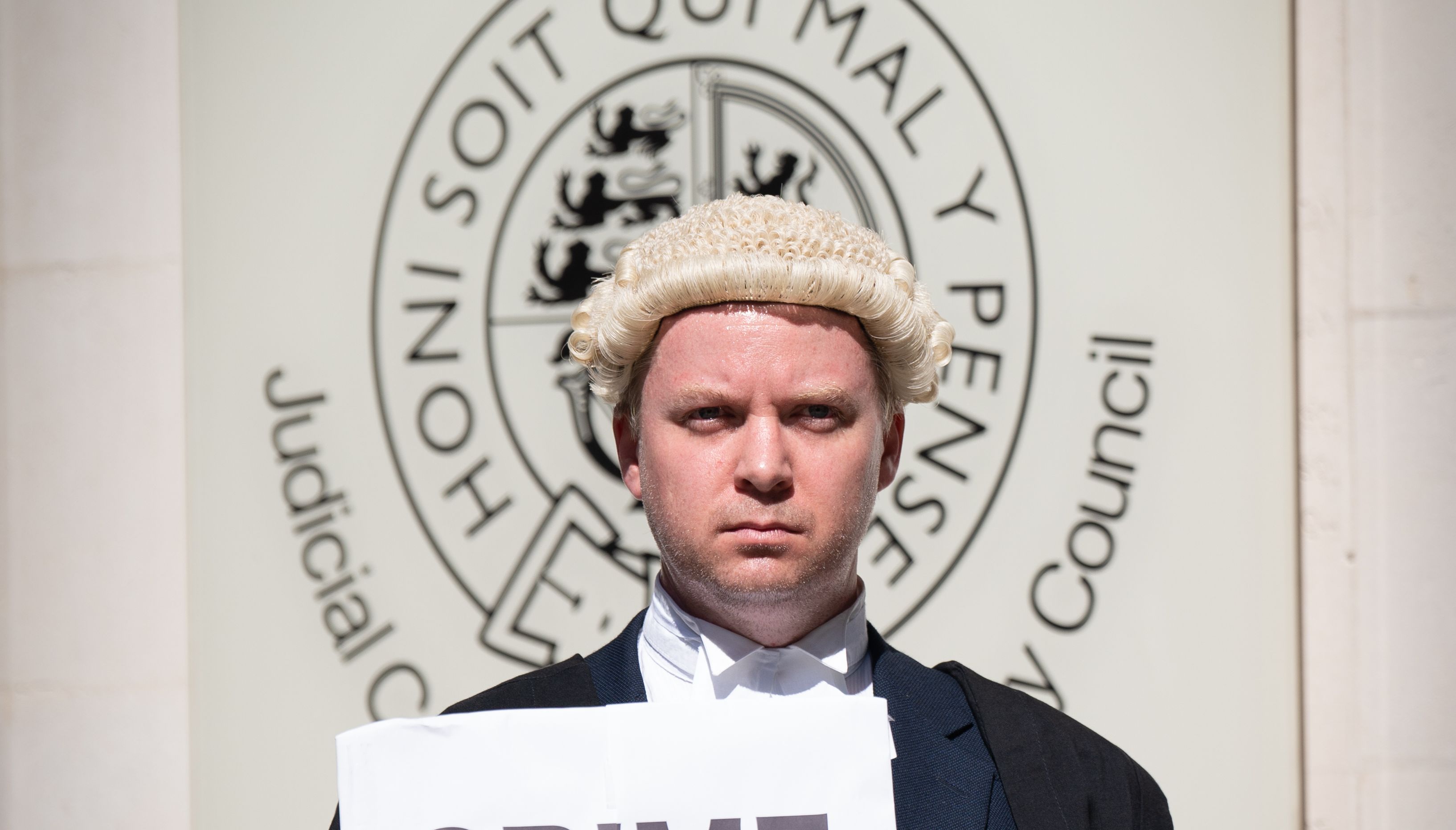 Criminal defence barristers outside the Houses of Parliament in London as they support the ongoing Criminal Bar Association (CBA) action over Government set fees for legal aid advocacy work. Picture date: Monday July 11, 2022.
