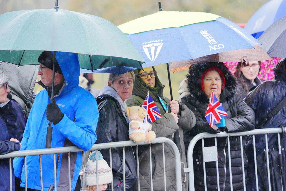 Crowd gathers waiting for the King and Queen