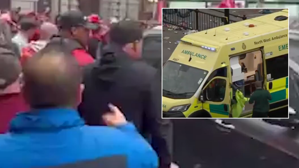 Crowds gather around a vehicle