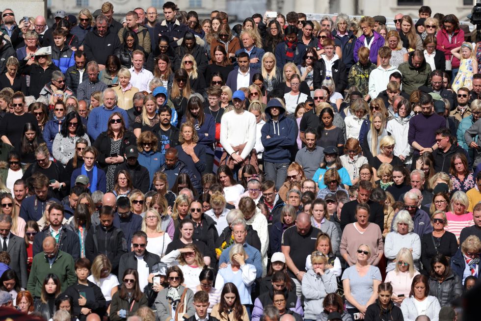 Crowds on The Mall stand for a two minutes silence during the state funeral and burial of Britain\u2019s Queen Elizabeth in London, Britain September 19, 2022.   REUTERS/Kevin Coombs