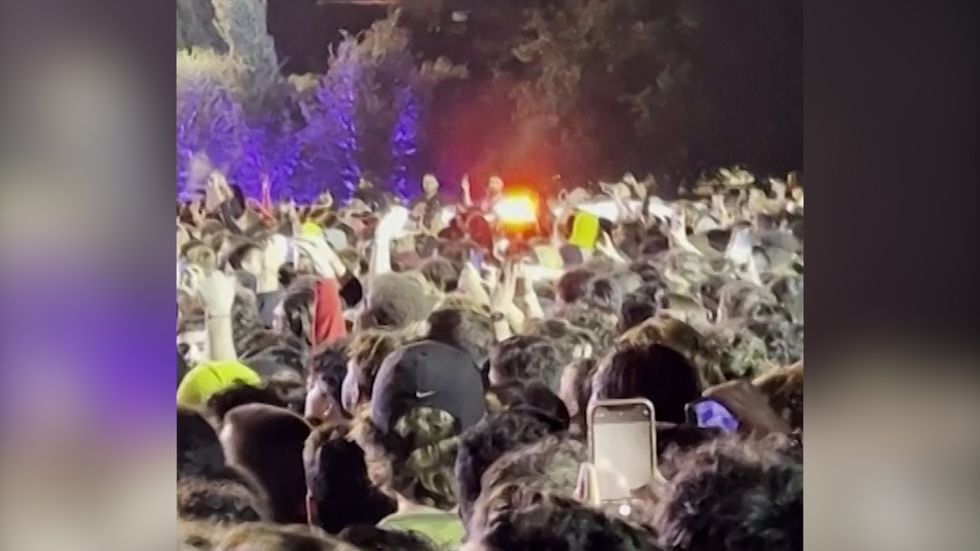 Crowds surge during a performance by Travis Scott during the Astroworld festival in Houston, Texas