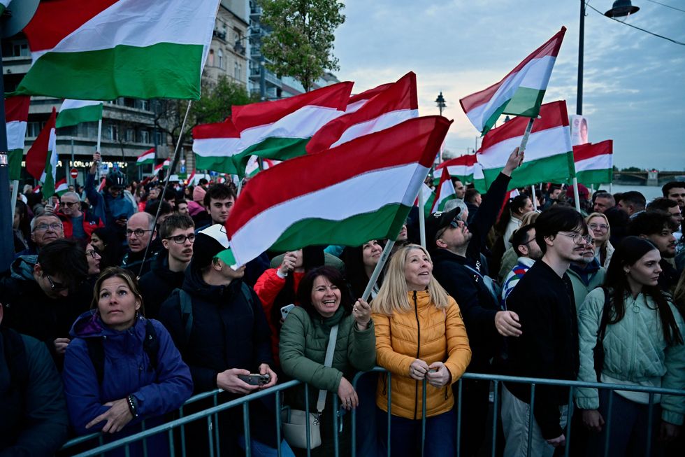 Crowds waving Hungarian flags