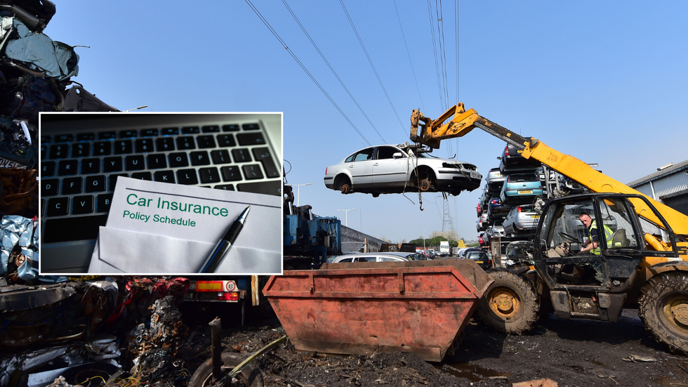 crushed vehicle and car insurance sign