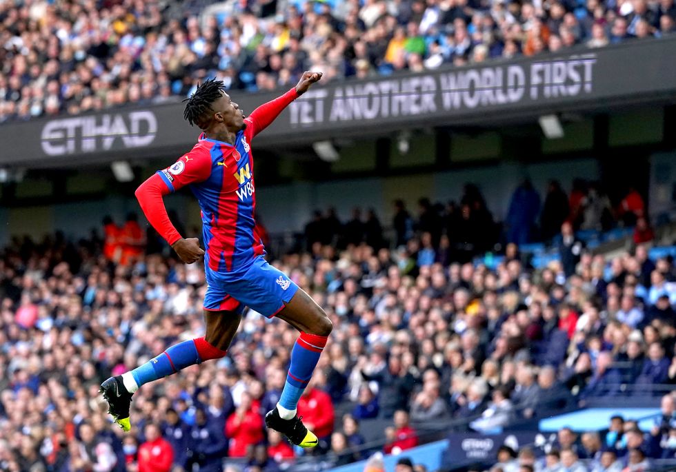 Crystal Palace's Wilfried Zaha celebrates scoring their side's first goal of the game during the Premier League match at the Etihad Stadium, Manchester.