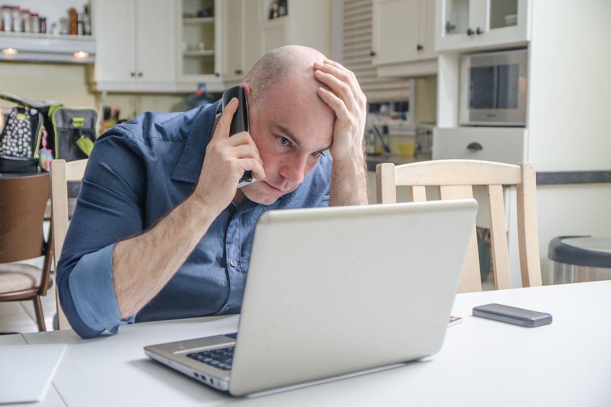 Customer worried at laptop