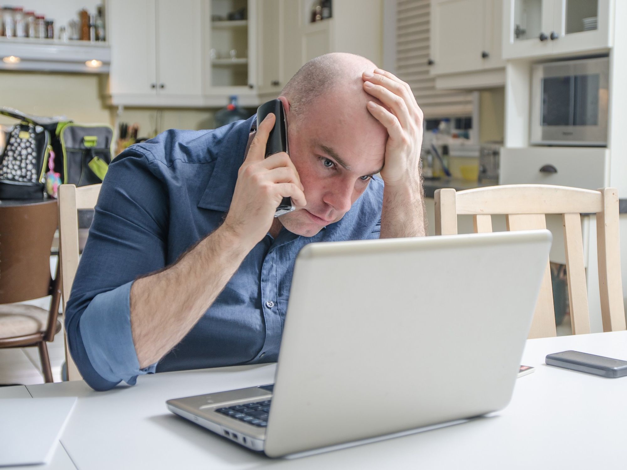 Customer worried at laptop