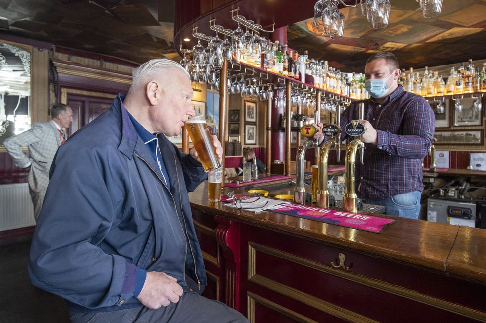 Customers in the Waverley, Edinburgh, enjoy a drink inside the bar, as Scotland eases out of lockdown.