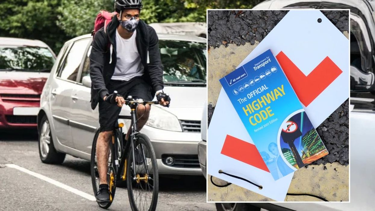 Cyclist and a copy of the Highway Code