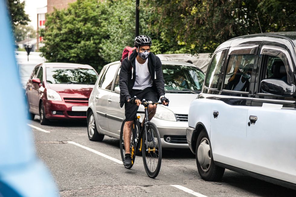 Cyclist and cars in traffic