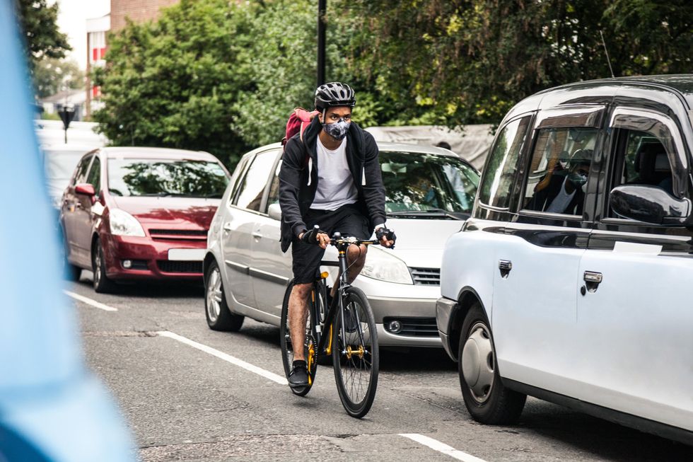 Cyclist and cars on the road