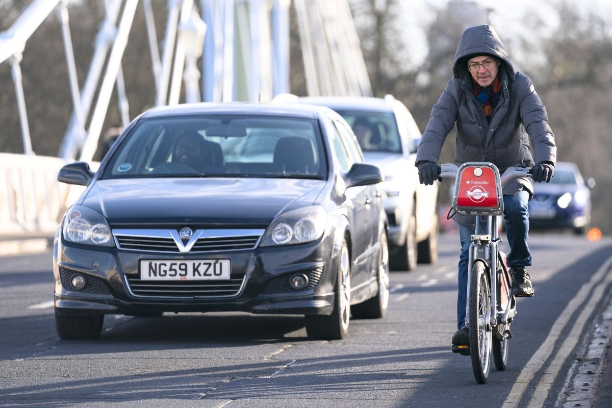 Cyclist driving in traffic