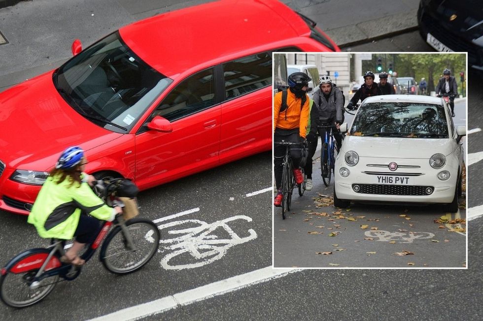 Cyclist driving past cars in a cycle lane
