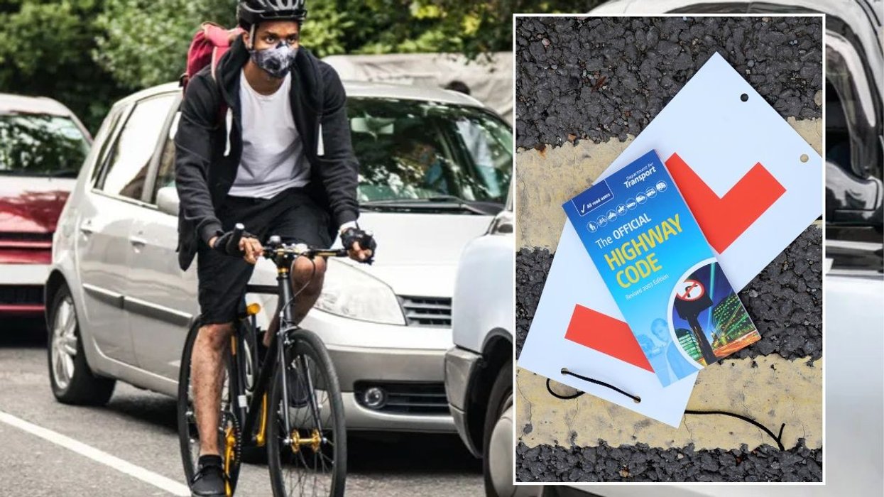 Cyclist on the road and a copy of the Highway Code