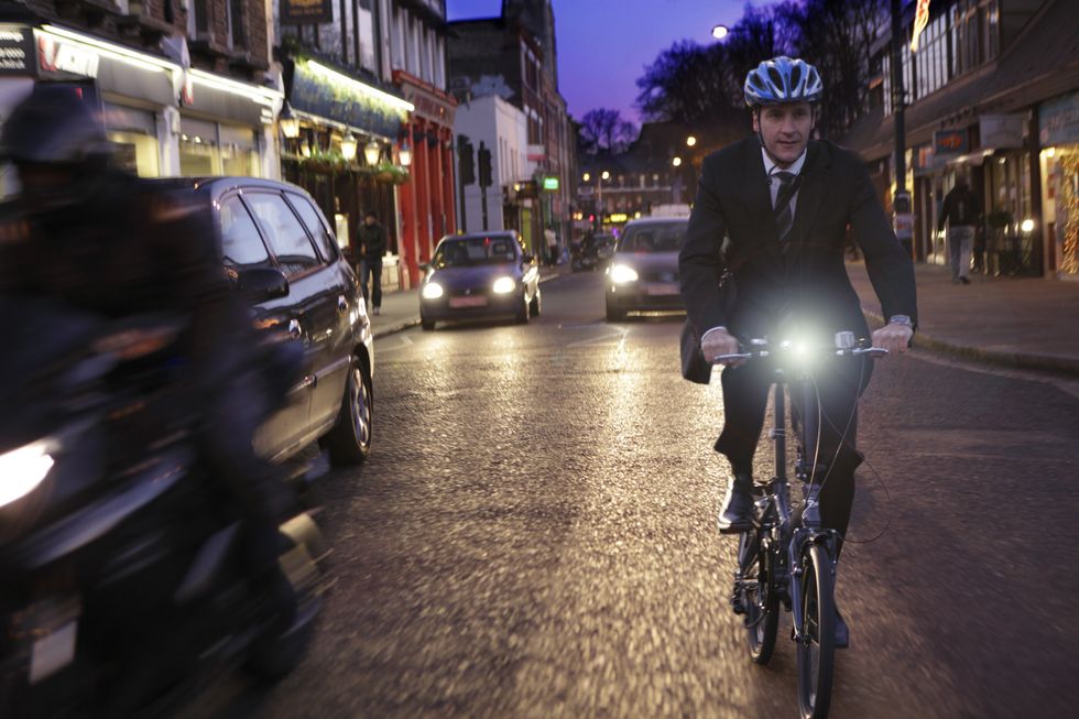 Cyclist riding on a busy street