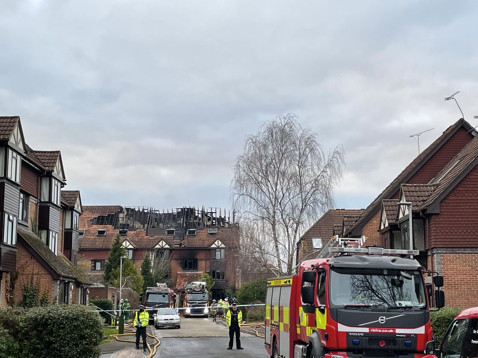 Damage to a property in Grovelands Road, Reading, where one person has died and others are %22unaccounted for%22 in a large fire. Police have arrested a 31-year-old man on suspicion of murder and arson. Picture date: Wednesday December 15, 2021.