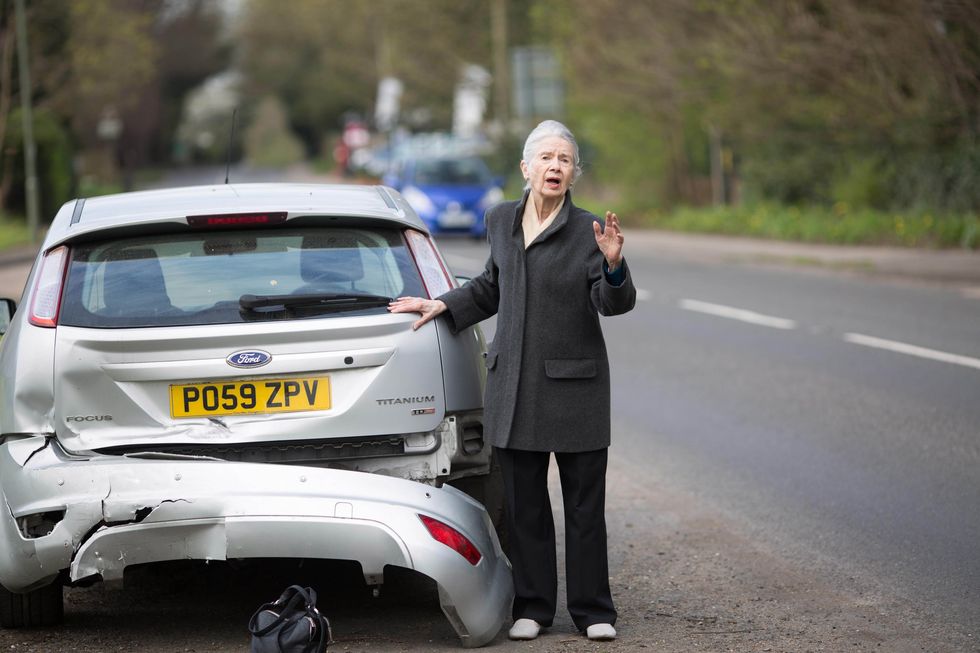 Damaged car on road
