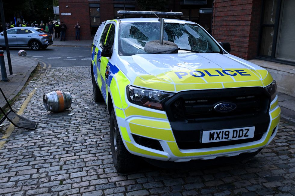 Damaged police car during Southport riots
