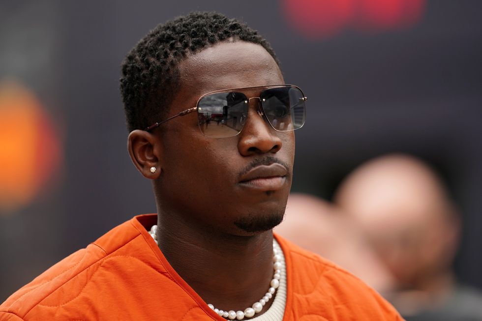 Damson Idris in orange jacket