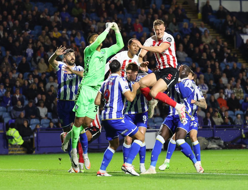 Dan Ballard of Sunderland goes up with Sheffield keeper Devis Vasquez