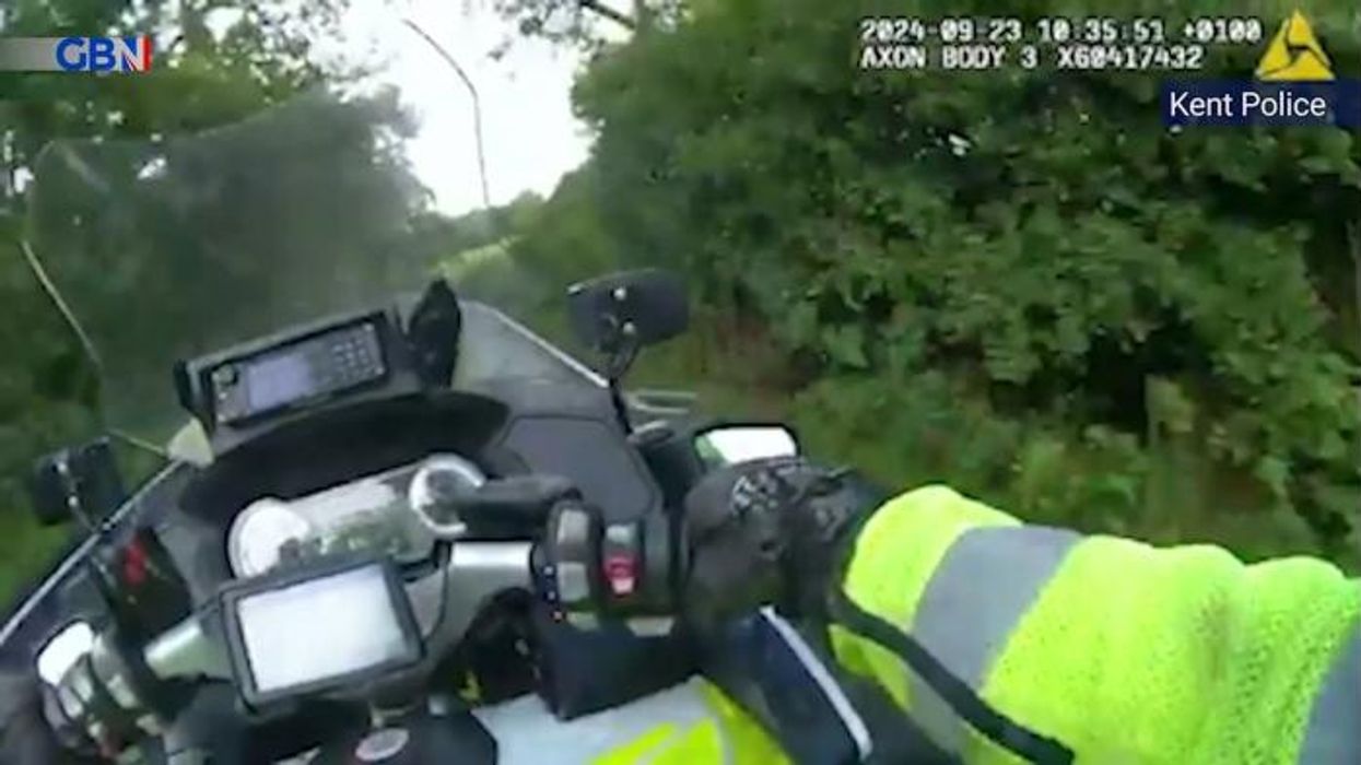 Police officer forced to JUMP from bike after dangerous driver tries to ram him in high-speed pursuit