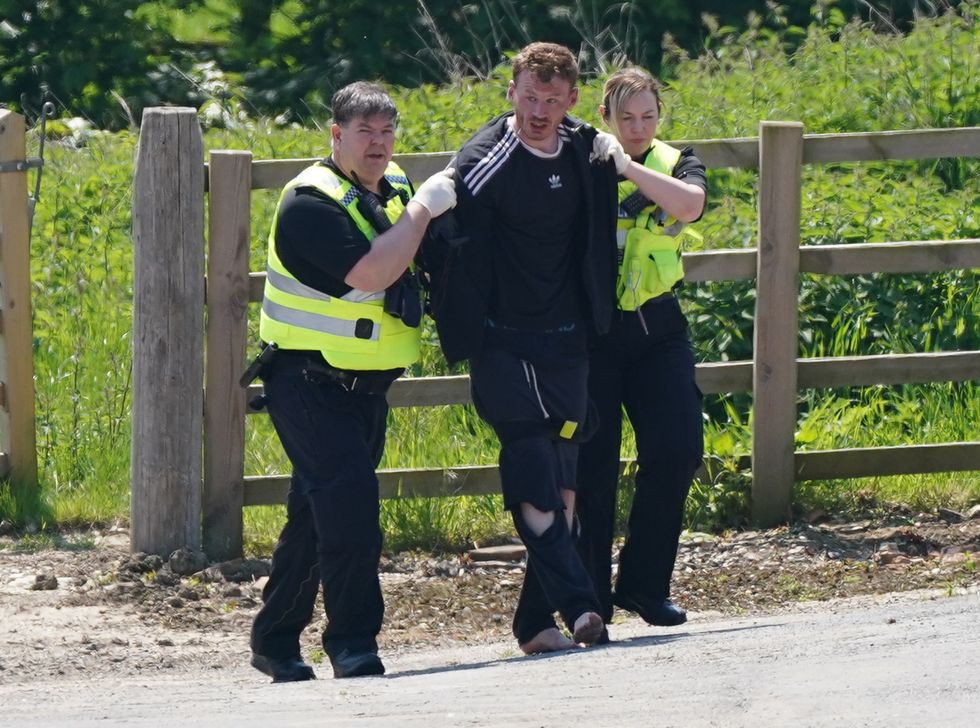 Daniel Boulton being detained at Hallington House Farm, on the outskirts of Louth, Lincolnshire.