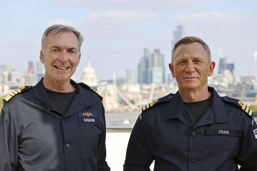 Daniel Craig (right), wearing the honorary Royal Navy rank of Commander he has received from the Head of the Royal Navy, First Sea Lord Admiral Sir Tony Radakin (left).