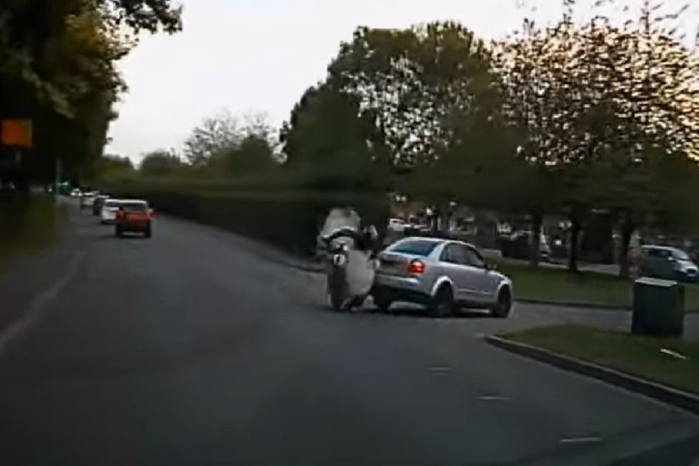 Dashcam footage shows the moment the biker collided with the car
