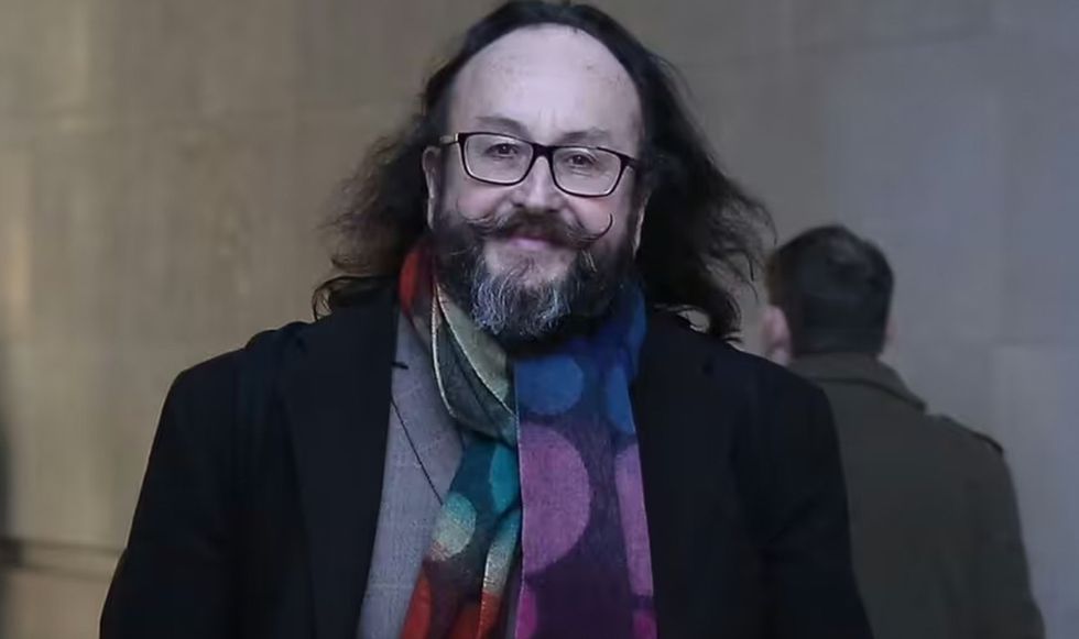 Dave Myers smiling as he walks