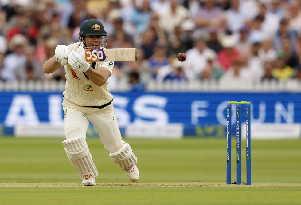 David Warner putting Jimmy Anderson's long half-volley through the covers