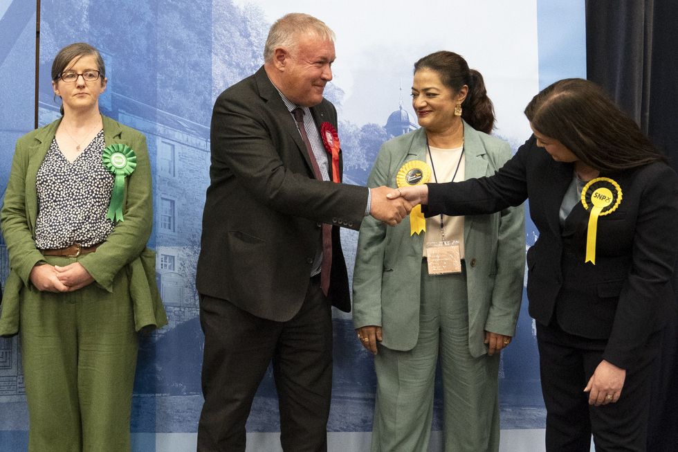 Davy Russell shaking hands with SNP's Katy Loudon