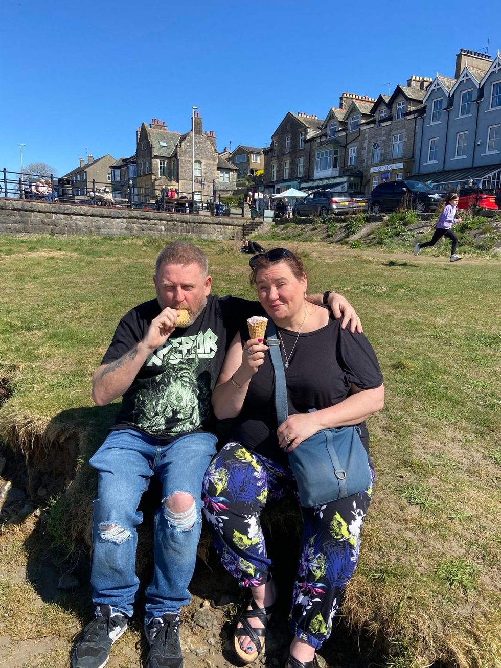 Dawn and Arron Clegg eating ice cream together outside
