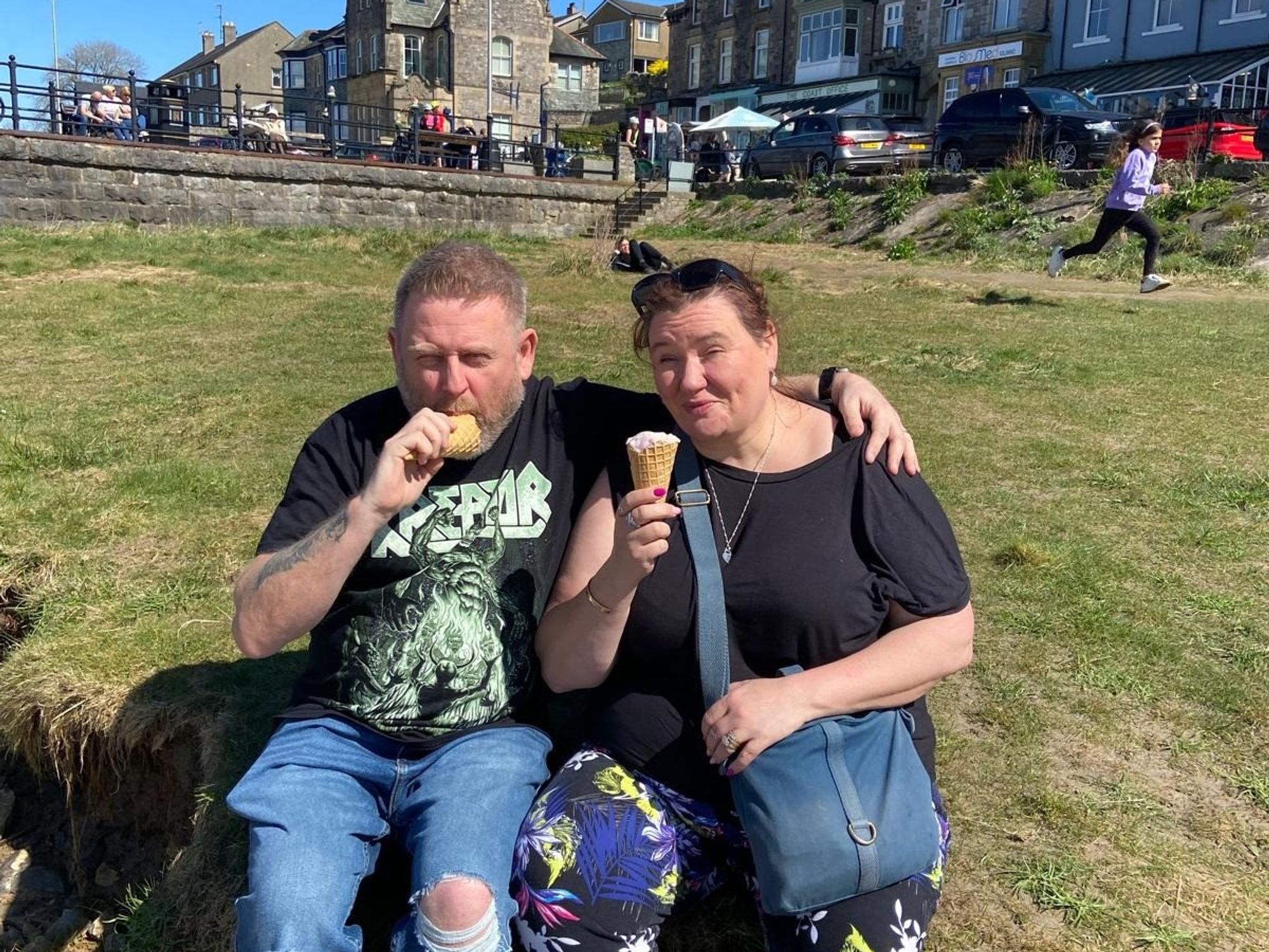 Dawn and Arron Clegg eating ice cream together outside