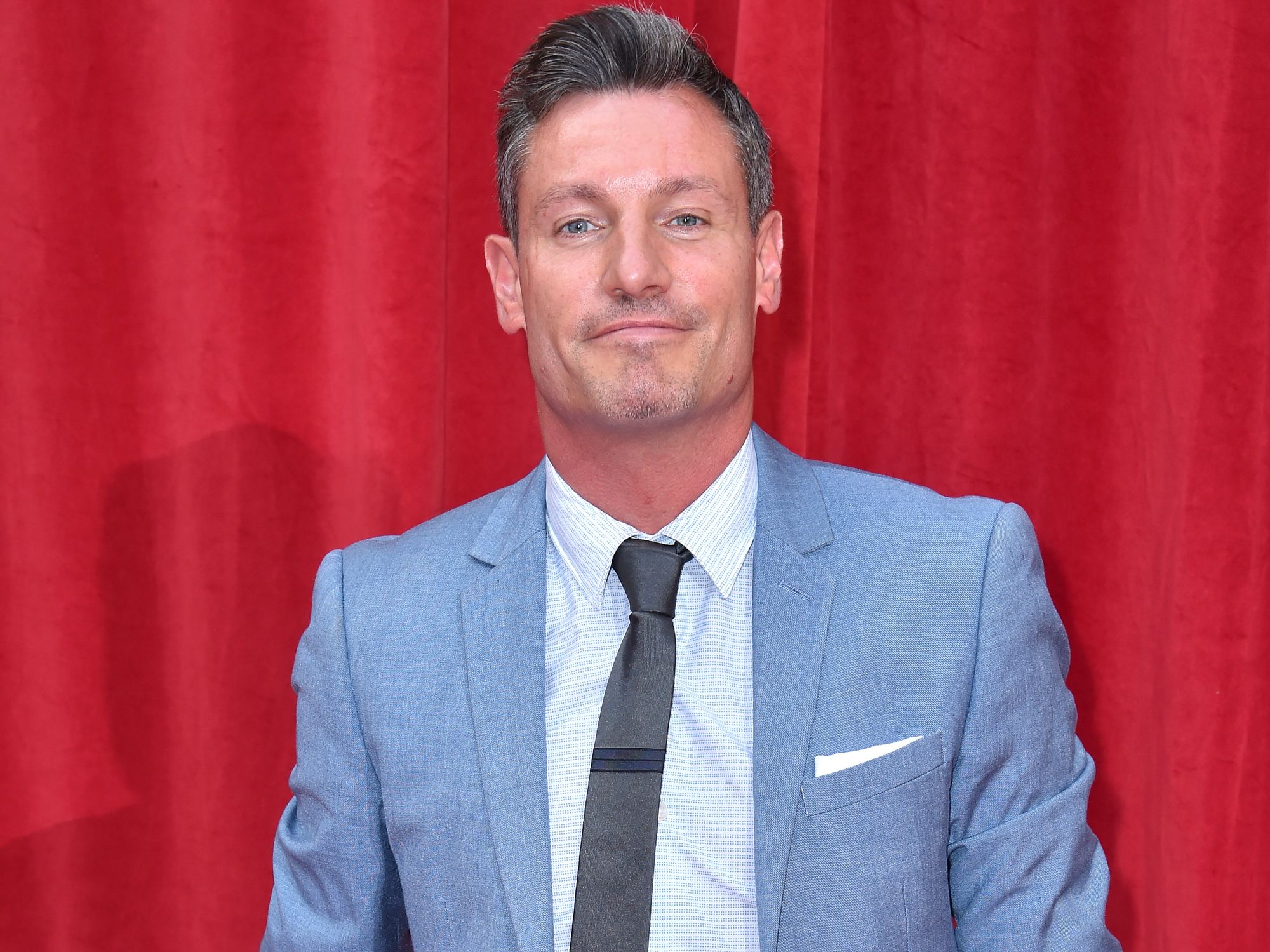 Dean Gaffney in a suit