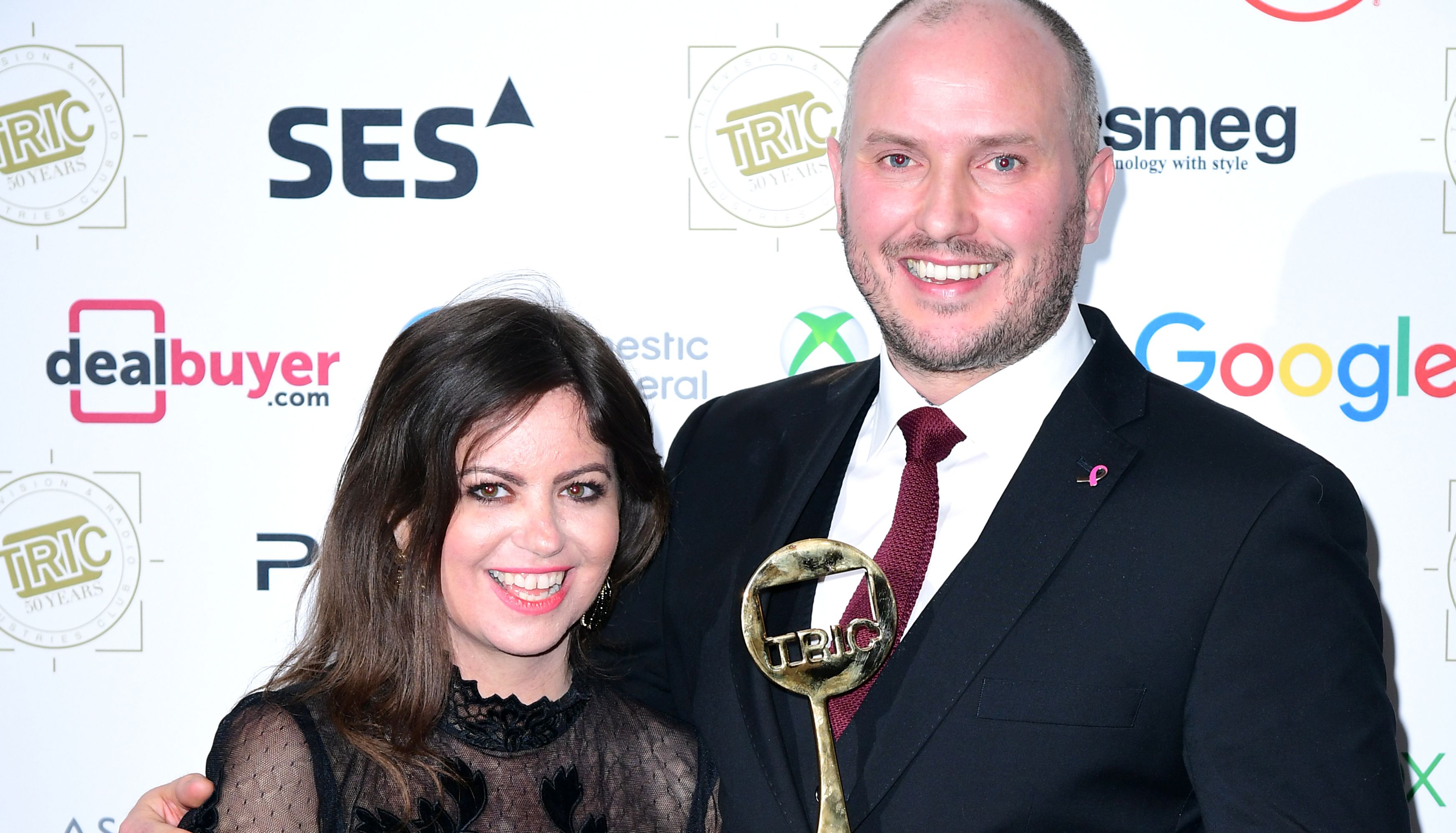 Deborah James (left) and Steve Bland with the award for Best Podcast for the show You, Me and the Big C at the TRIC Awards 2019, as Deborah James has reached the 4 million mark for her cancer research fundraising initiative.