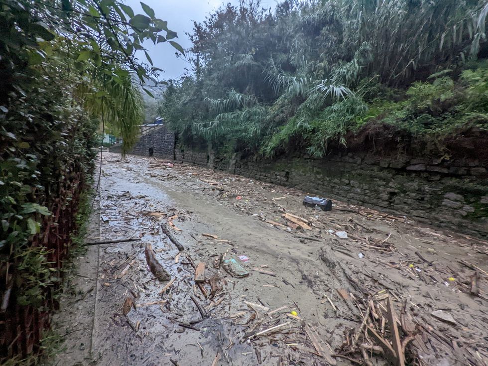 Debris are seen on the street, following a landslide on the Italian holiday island of Ischia, Italy, in this handout photo obtained by Reuters on November 26, 2022. Carabinieri/Handout via REUTERS THIS IMAGE HAS BEEN SUPPLIED BY A THIRD PARTY.