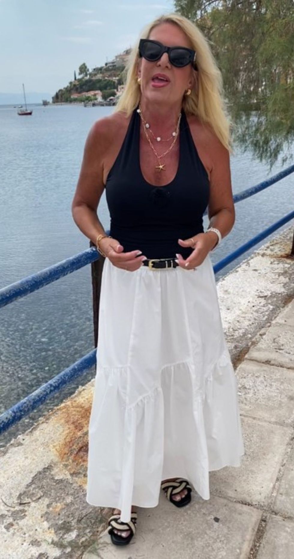 Deirdre Nicholas in a fitted top and maxi skirt