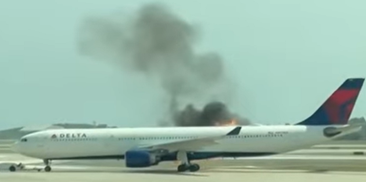 NextImg:Plane engine catches fire on airport runway with passengers forced to evacuate on slides