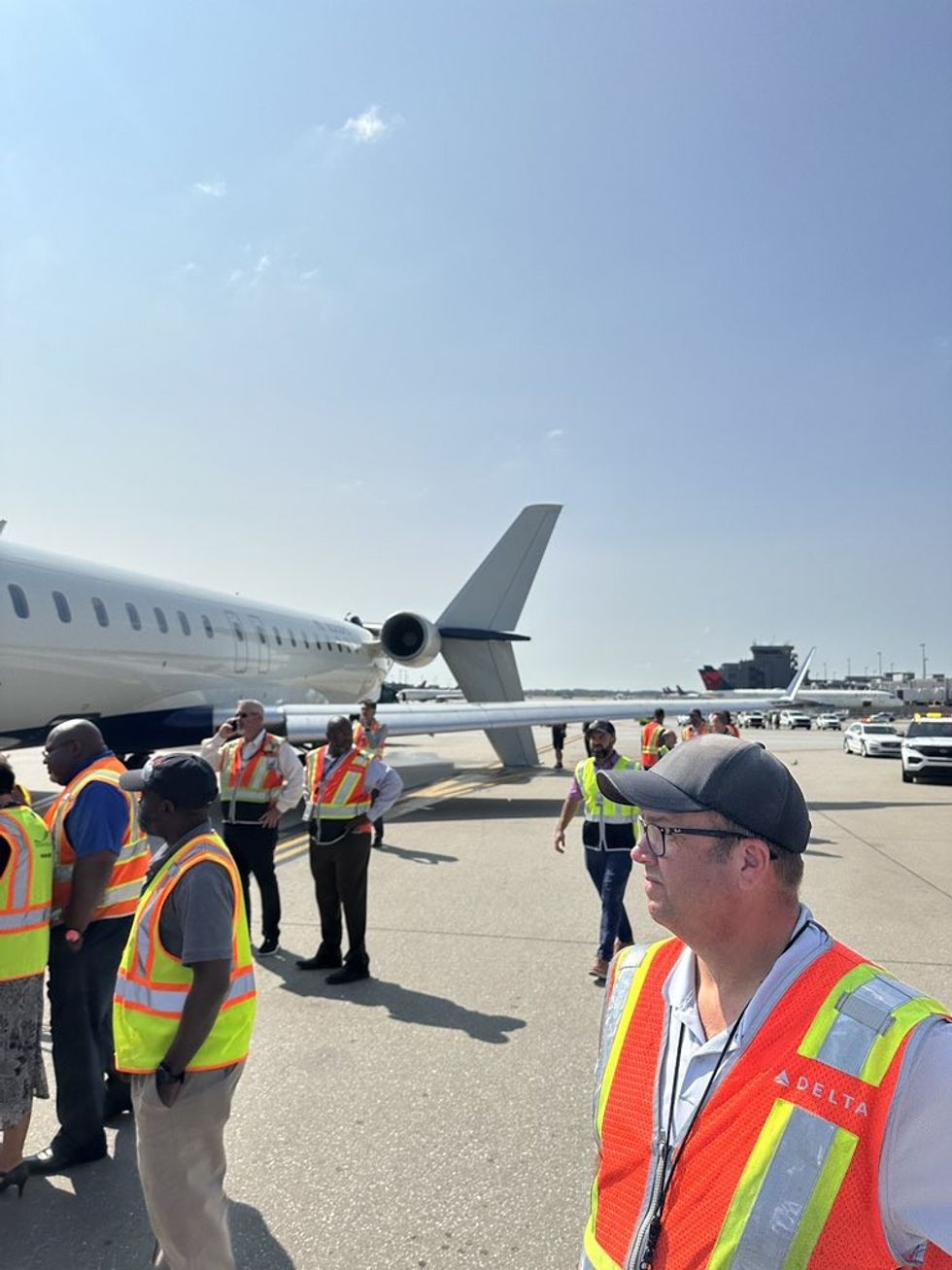 Delta and airport staff attended the scene following the collision