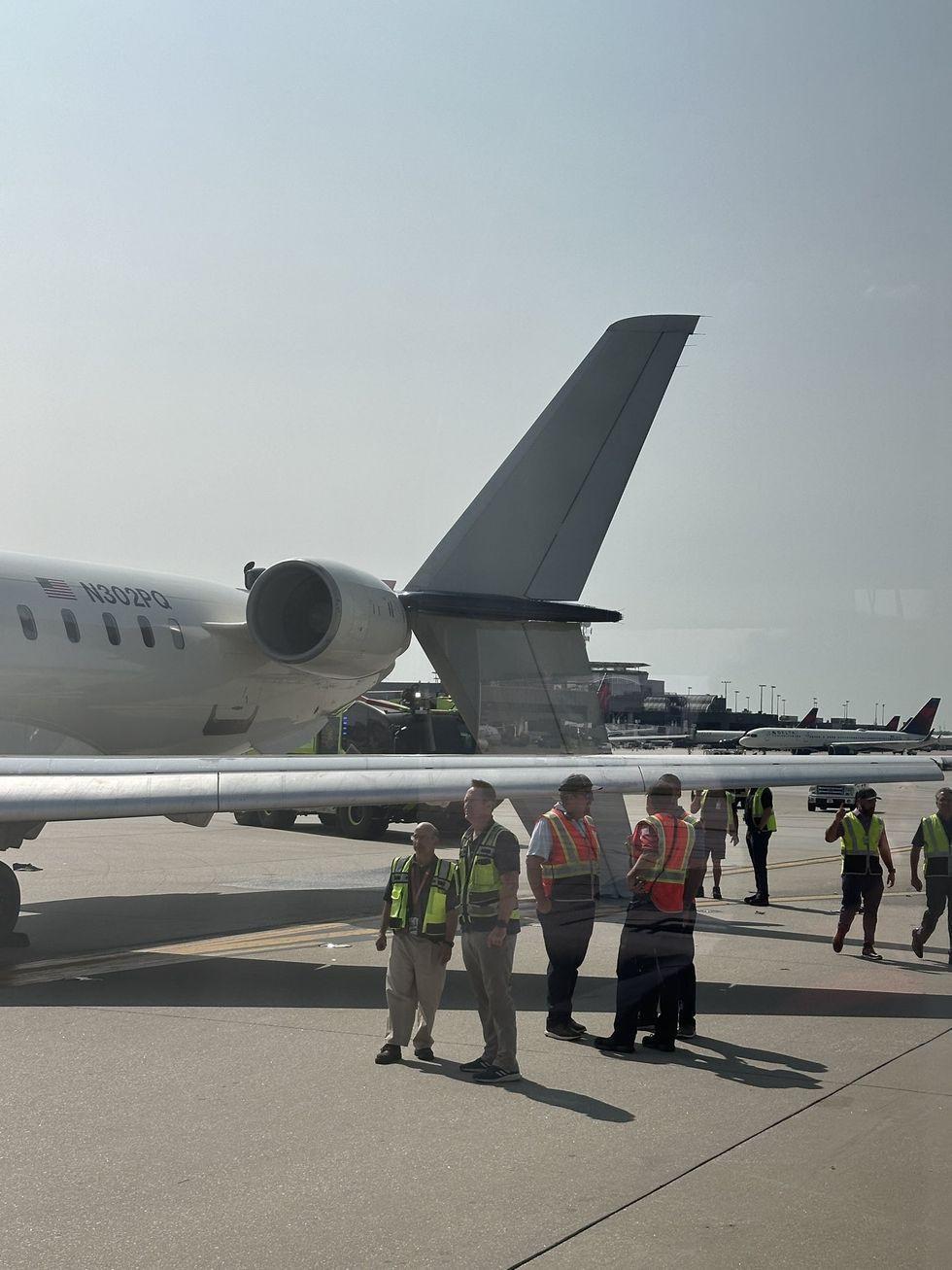 Delta and airport staff attended the scene following the collision