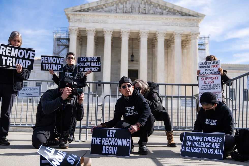 Demonstrators are seen as the Supreme Court heard arguments on whether Colorado could keep former President Donald Trump off the 2024 presidential ballot