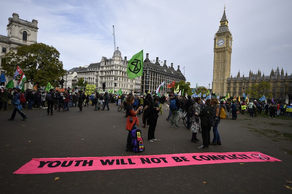 Demonstrators at an Extinction Rebellion protest at Parliament Square in London. Picture date: Sunday October 16, 2022.
