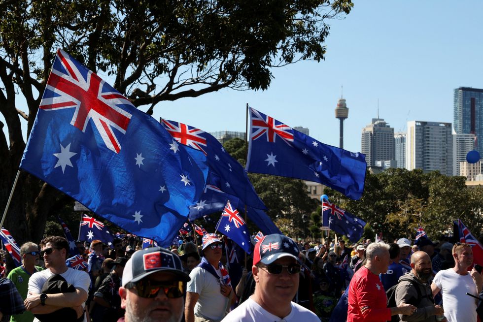 Demonstrators carry Australian flags during the 'March for Australia' anti-immigration rally, in Sydney\u200b