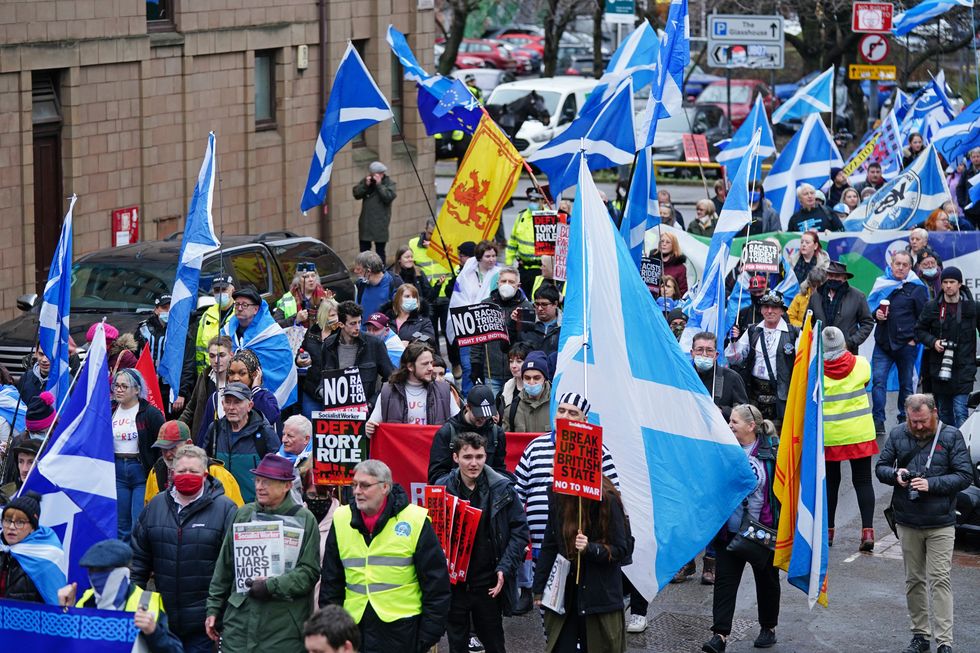Demonstrators from pro-independence organisation All Under One Banner take part in a "emergency demonstration" in Glasgow, against the Prime Minister, calling for the "end of Tory rule" and "independence now"